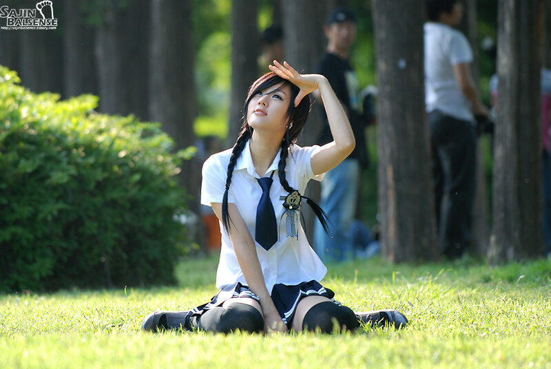 girl in school uniform on grass
