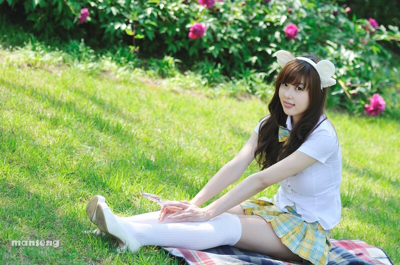 girl in school uniform on grass