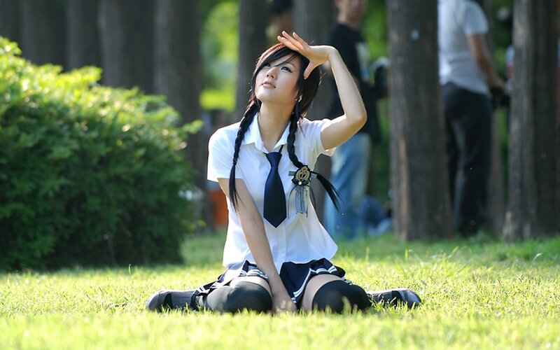 girl in school uniform on grass
