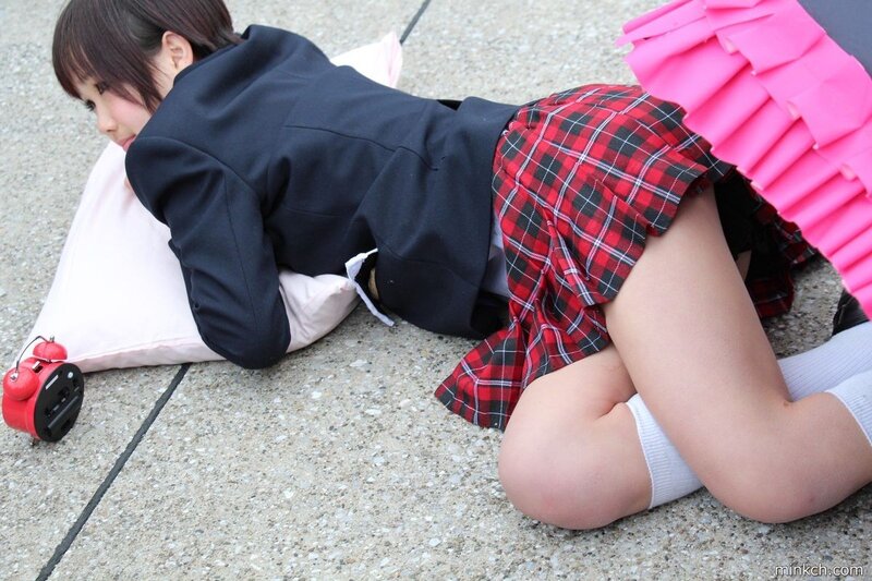 girl in school uniform on ground
