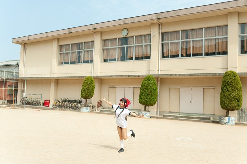 Girl in school uniform on playground
