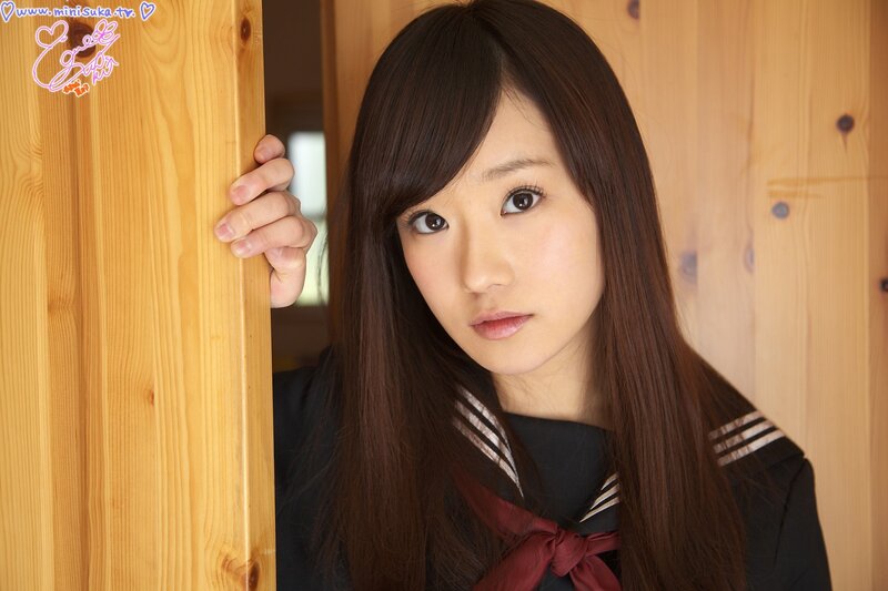 girl in school uniform peeking