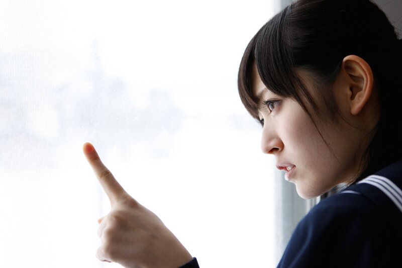 girl in school uniform pointing