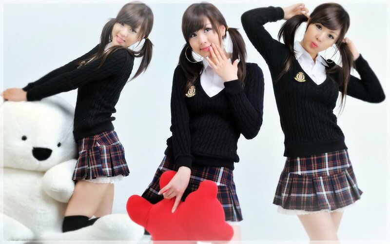 girl in school uniform poses