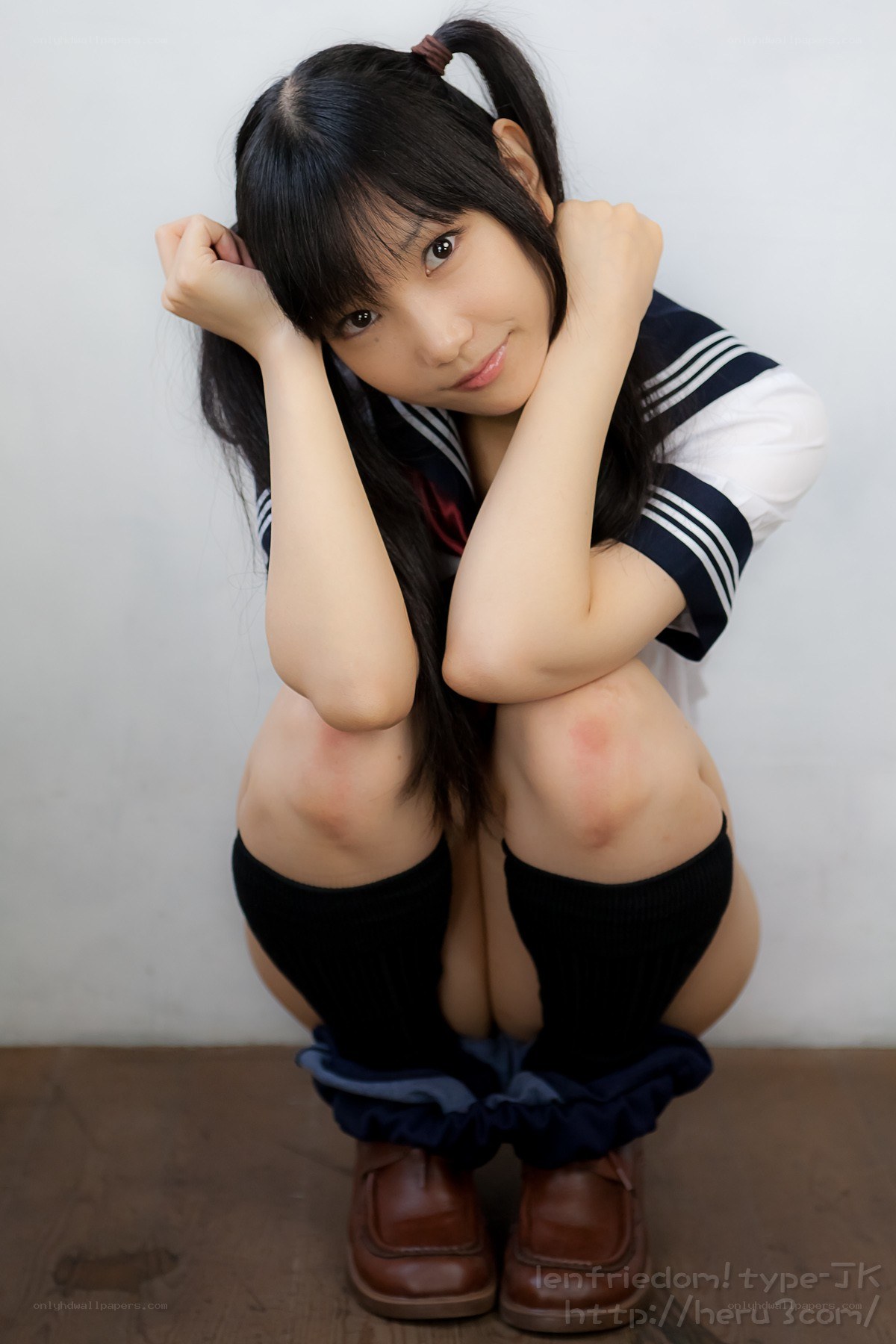 girl in school uniform posing