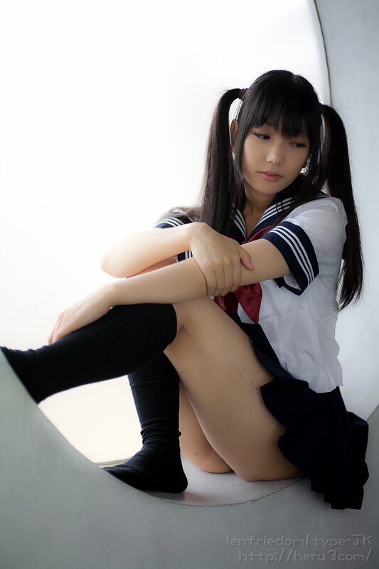 girl in school uniform sitting
