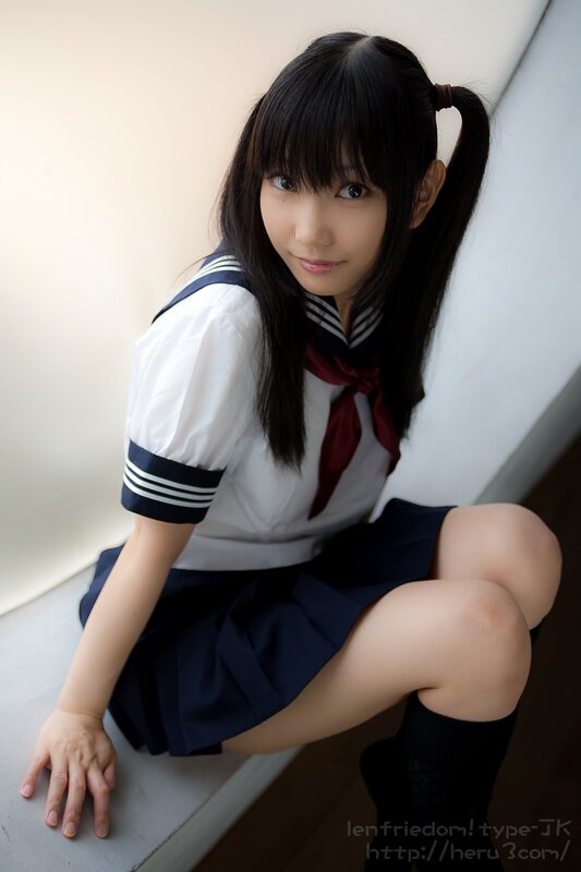 girl in school uniform sitting
