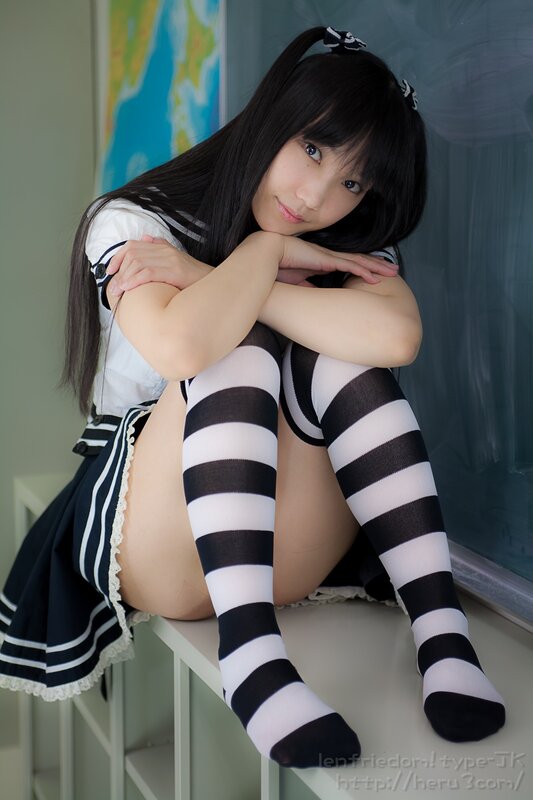 girl in school uniform sitting