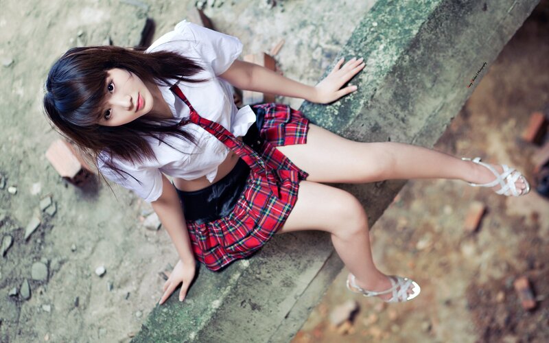 girl in school uniform sitting