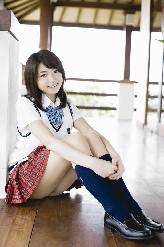 girl in school uniform sitting