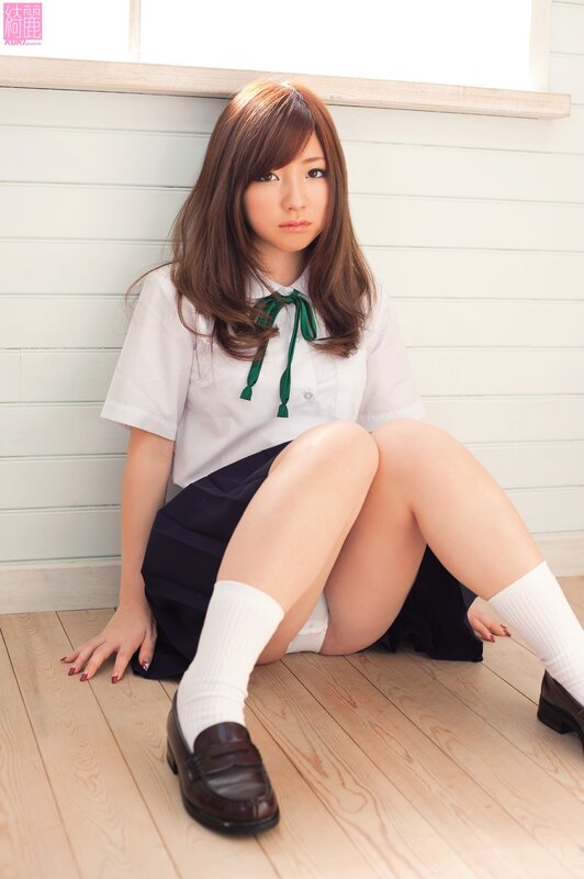 girl in school uniform sitting