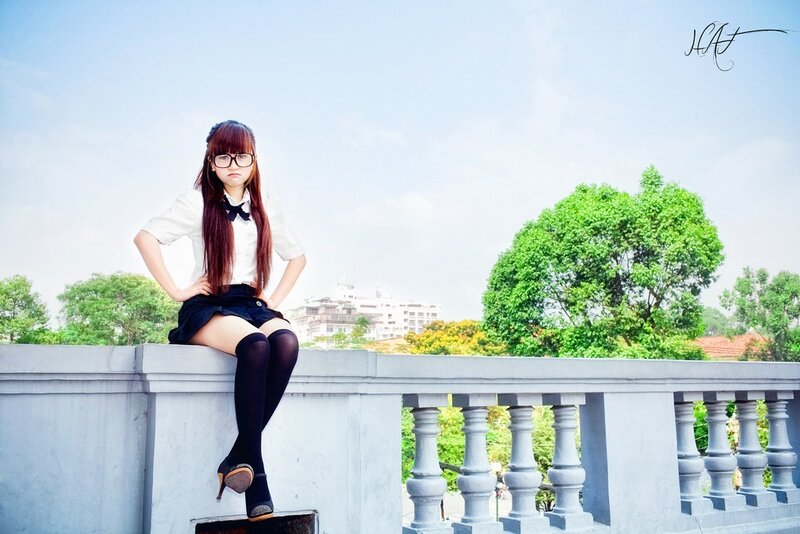 girl in school uniform sitting