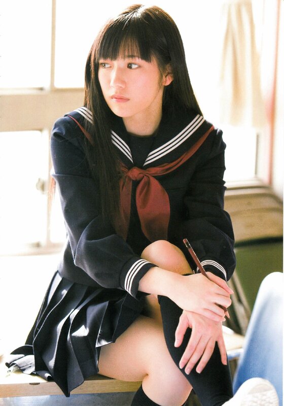 girl in school uniform sitting