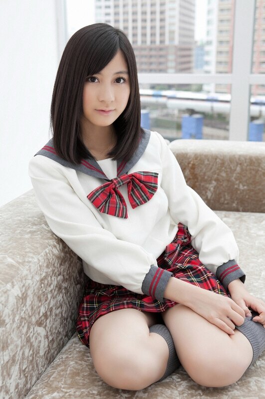 girl in school uniform sitting