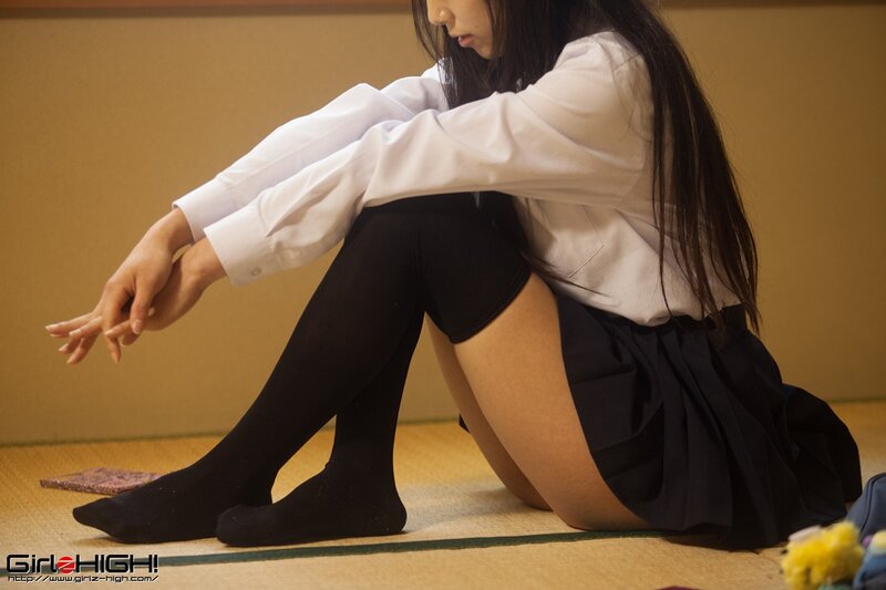 girl in school uniform sitting