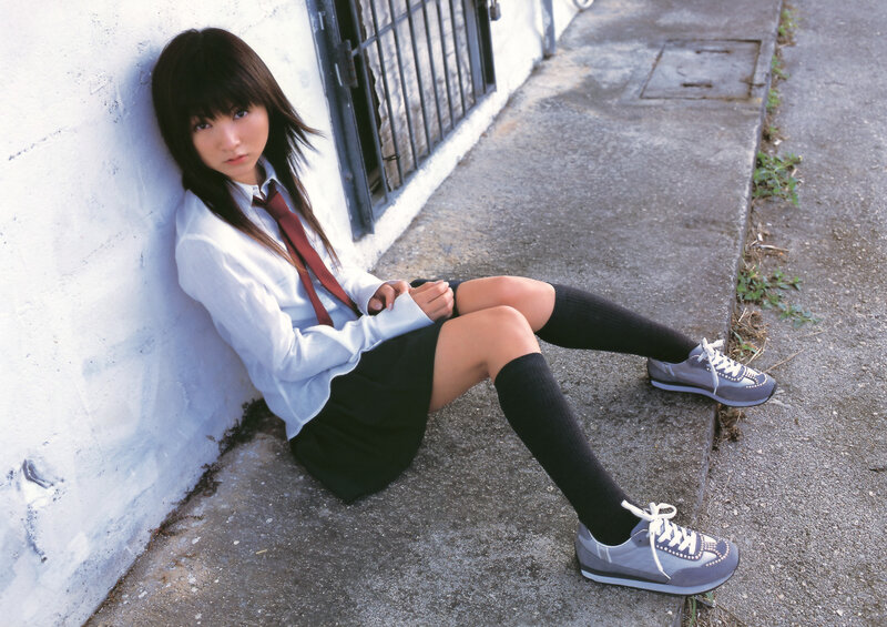 girl in school uniform sitting
