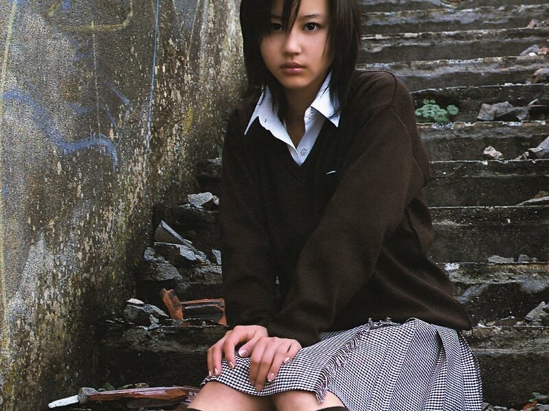 girl in school uniform sitting