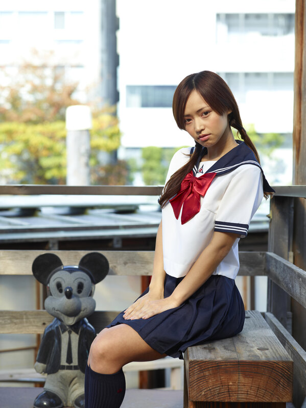 girl in school uniform sitting