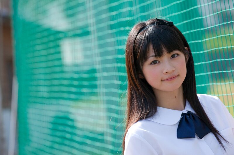 girl in school uniform smiling