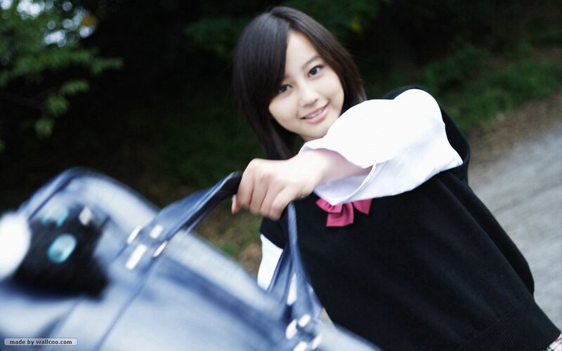 girl in school uniform smiling