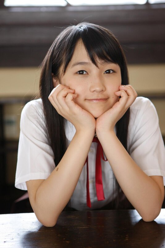 girl in school uniform smiling