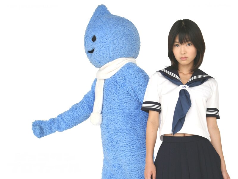 Girl in school uniform with blue mascot