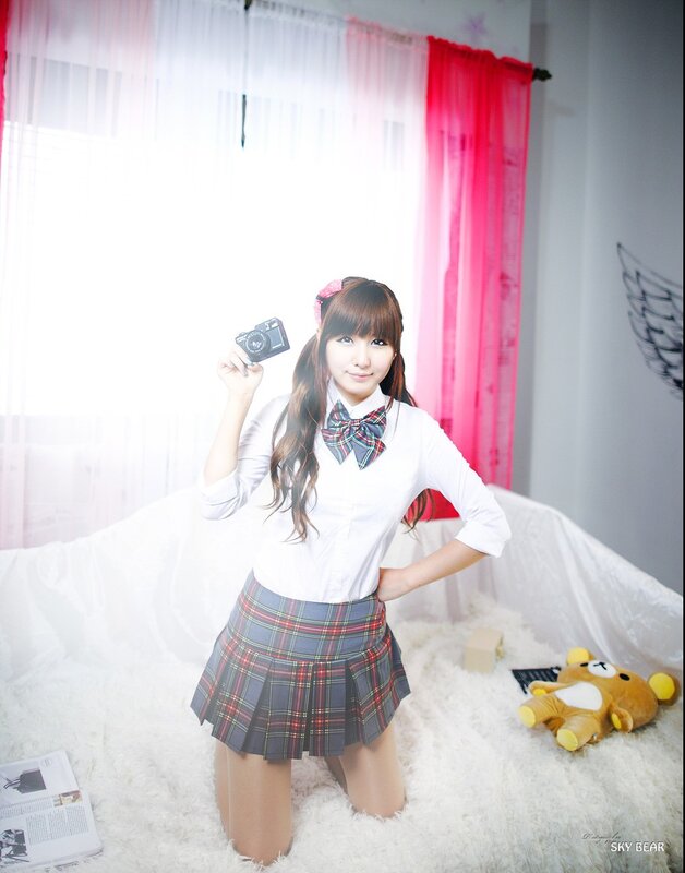 girl in school uniform with camera