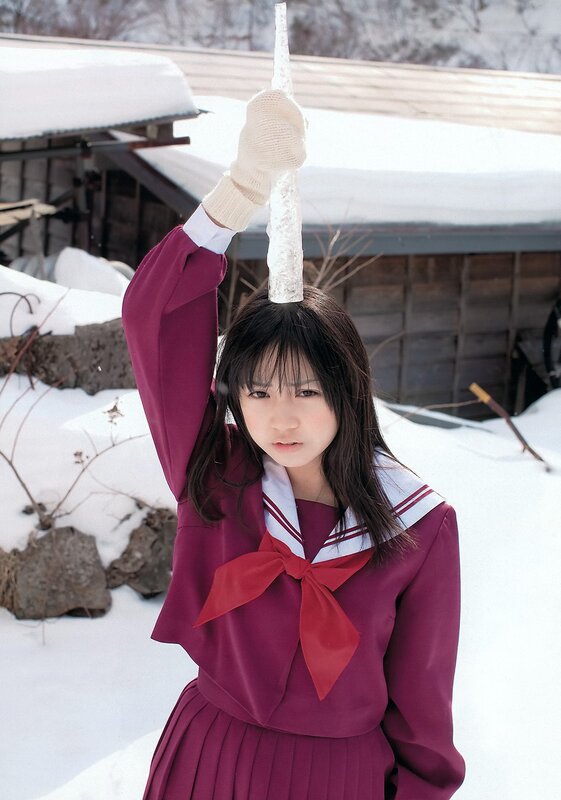Girl in school uniform with icicle