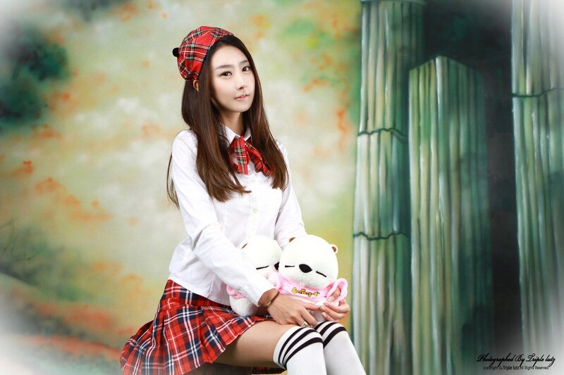 girl in school uniform with stuffed animals