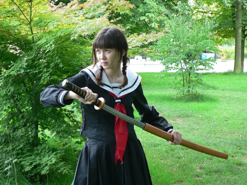 girl in school uniform with sword