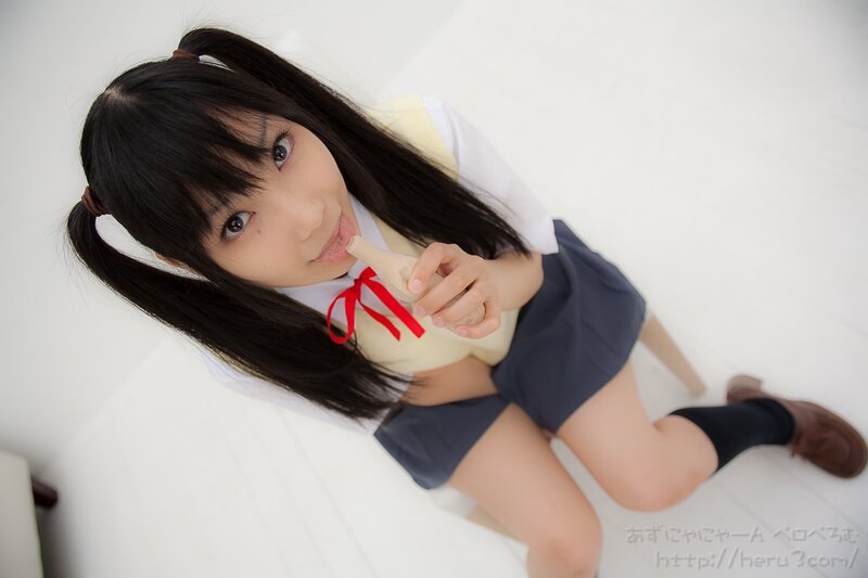 girl in school uniform with toy