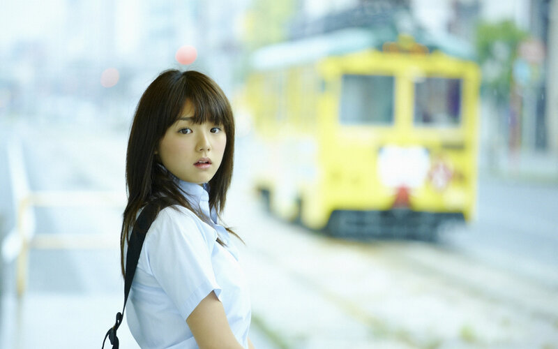 girl in school uniform with tram