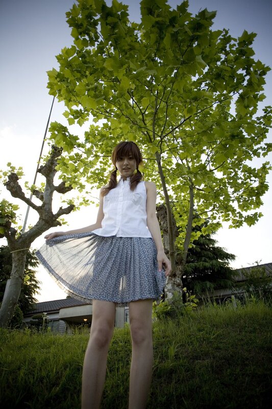 Girl in skirt under tree