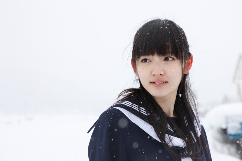 girl in snow with school uniform