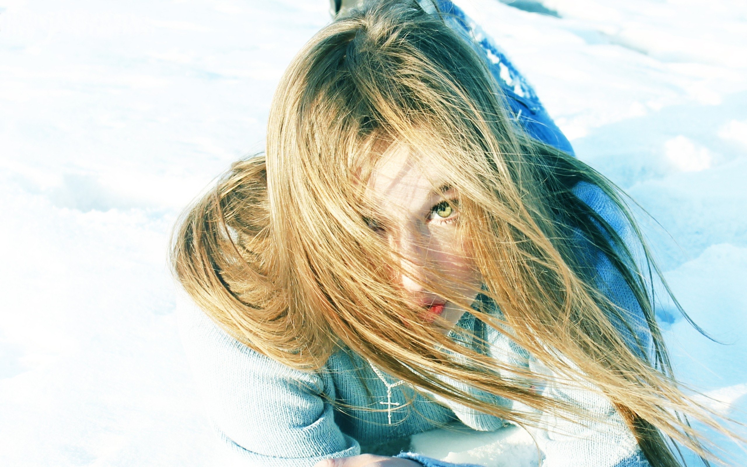 girl in snow with wind-blown hair