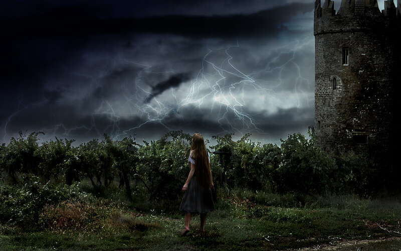 Girl in storm near castle