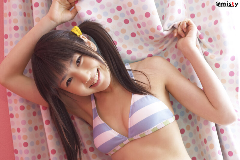 girl in striped bikini smiling