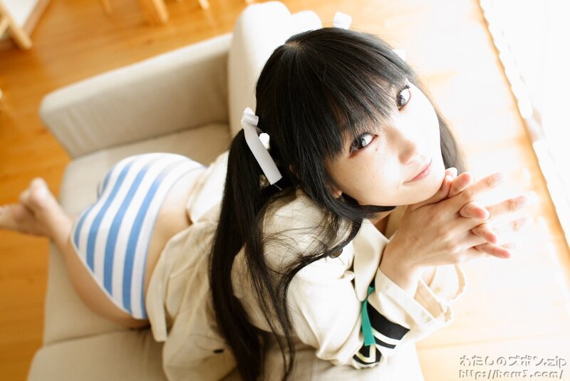 girl in striped shorts on couch