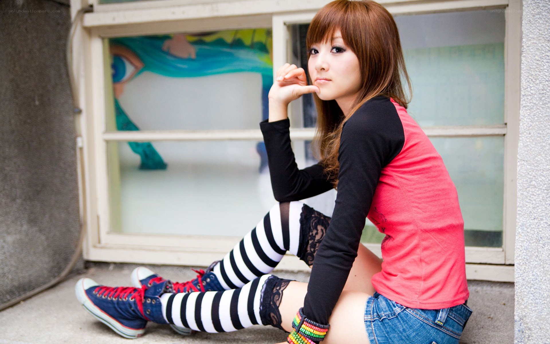 girl in striped socks sitting