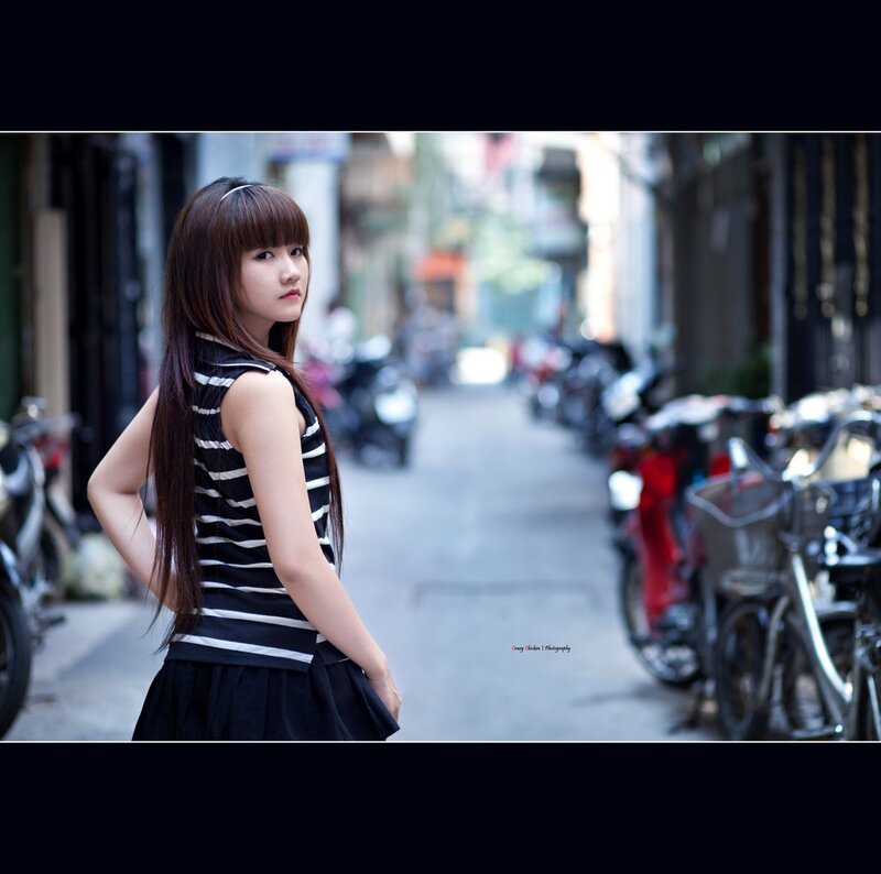 girl in striped top on street