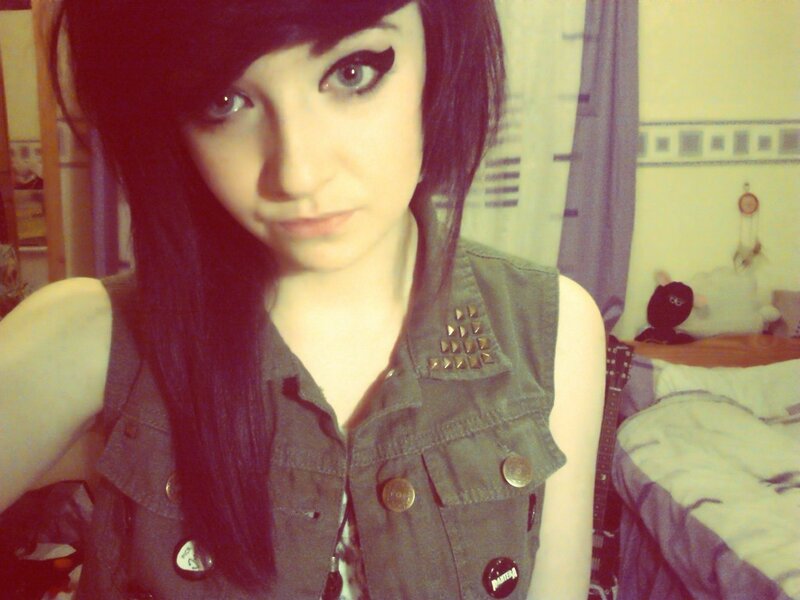 girl in studded vest