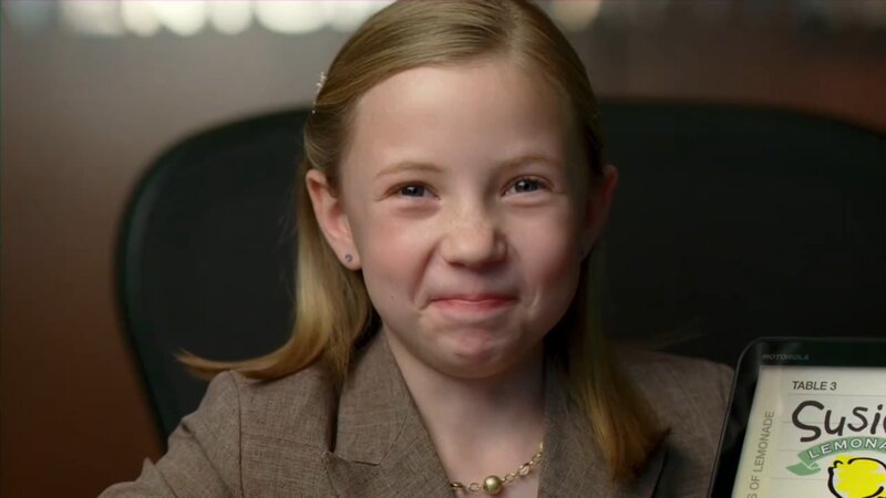 girl in suit with tablet
