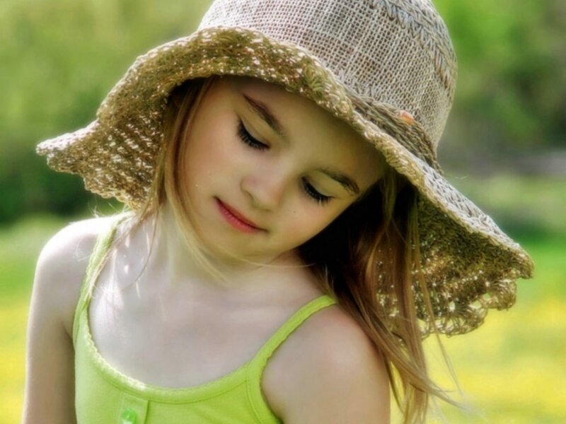 girl in sun hat outdoors