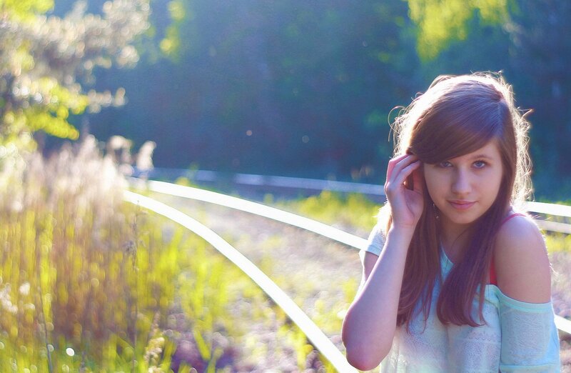 Girl in sunlit field
