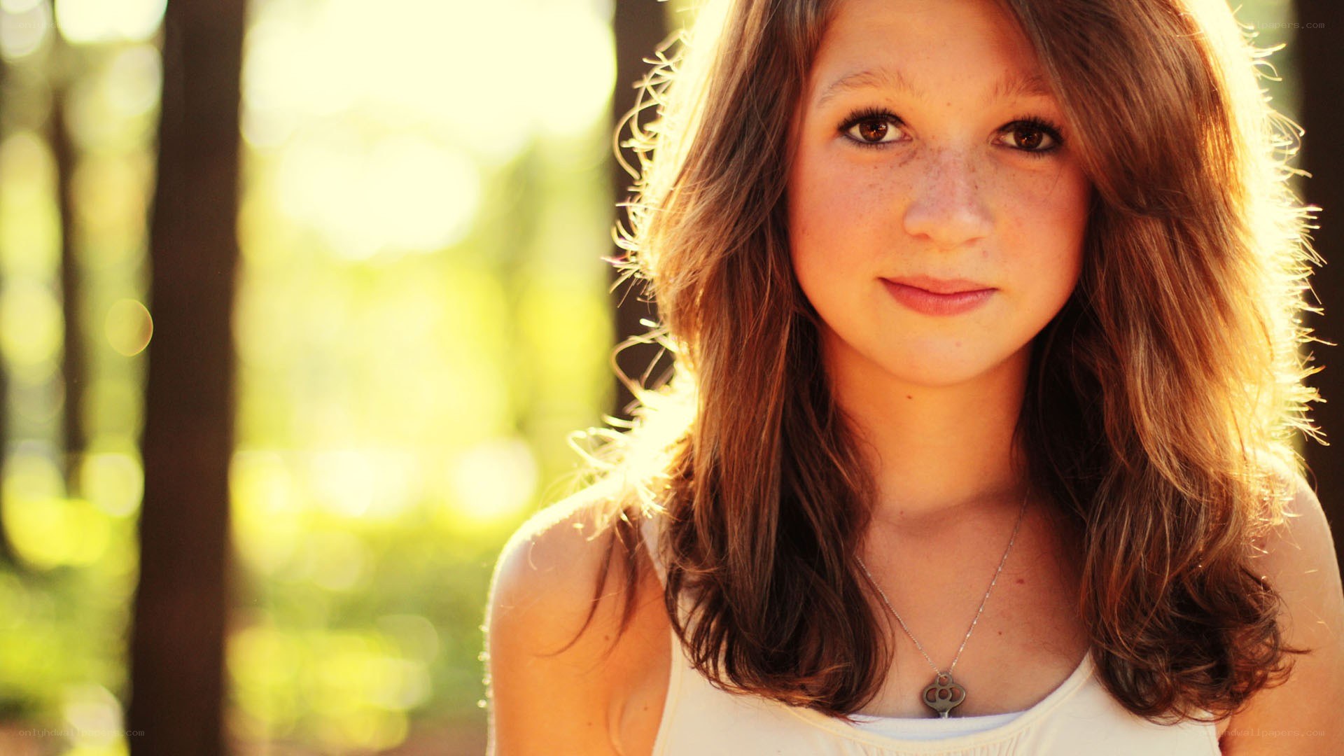 girl in sunlit forest
