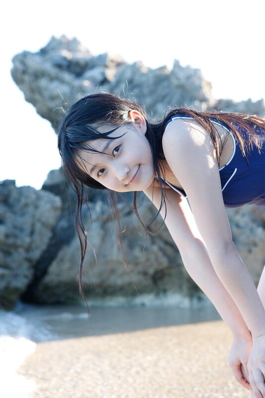 girl in swimsuit at beach