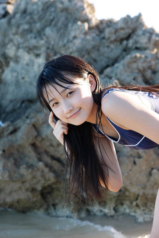 girl in swimsuit at beach