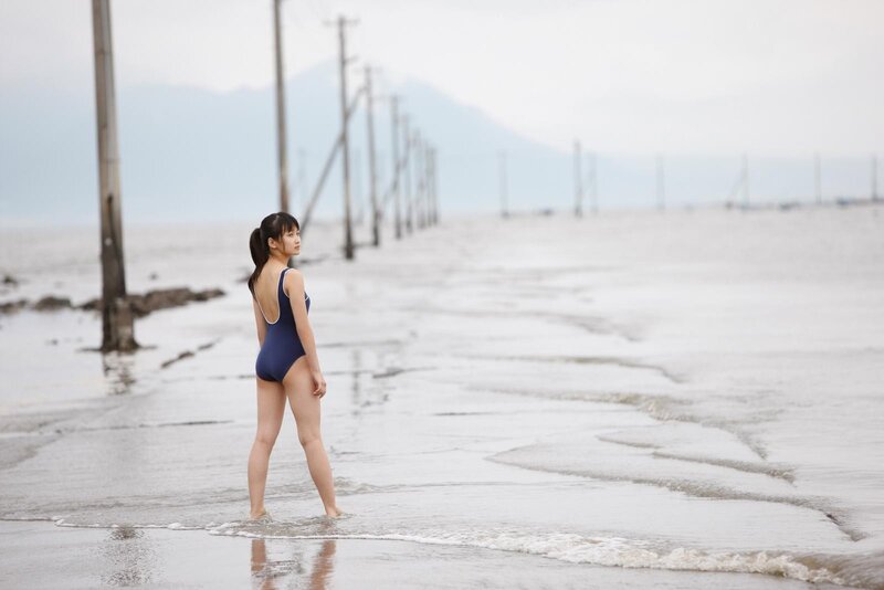 Girl in swimsuit on beach