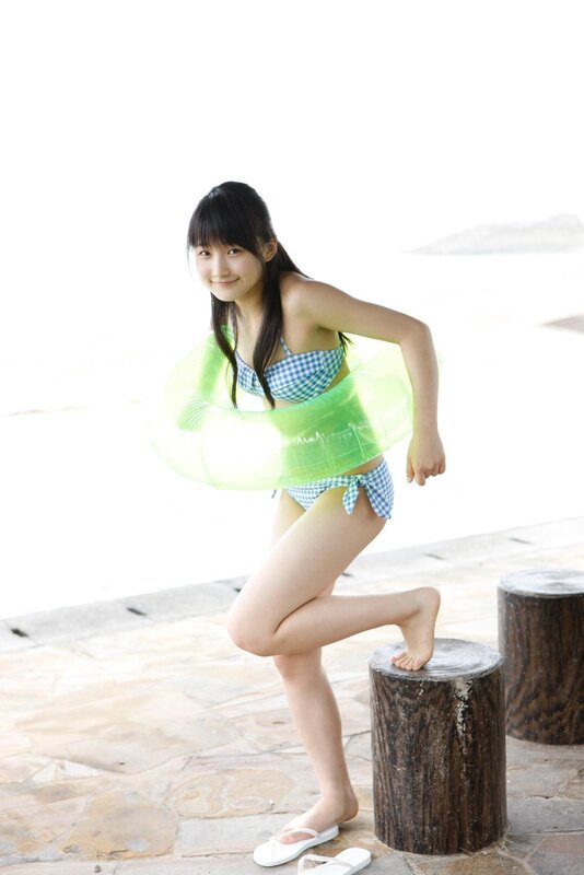 Girl in swimsuit with floatie