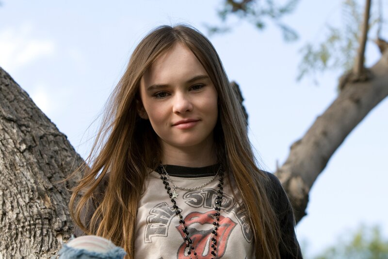 girl in t-shirt by tree